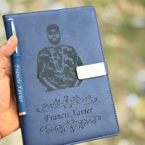Engraved blue leather book and pen