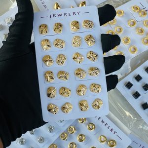 Gold earrings . Half pack