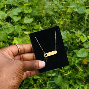 Engraved love bow tie drop necklace