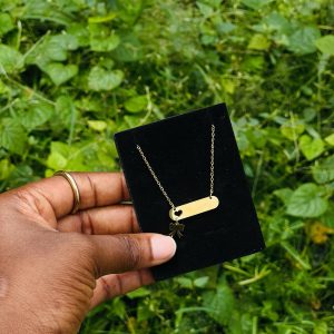 Engraved love bow tie drop necklace