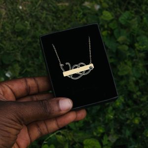 Engraved gold black stethoscope necklace