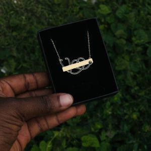 Engraved gold black stethoscope necklace