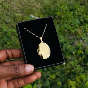 Engraved gold oval plain picture locket